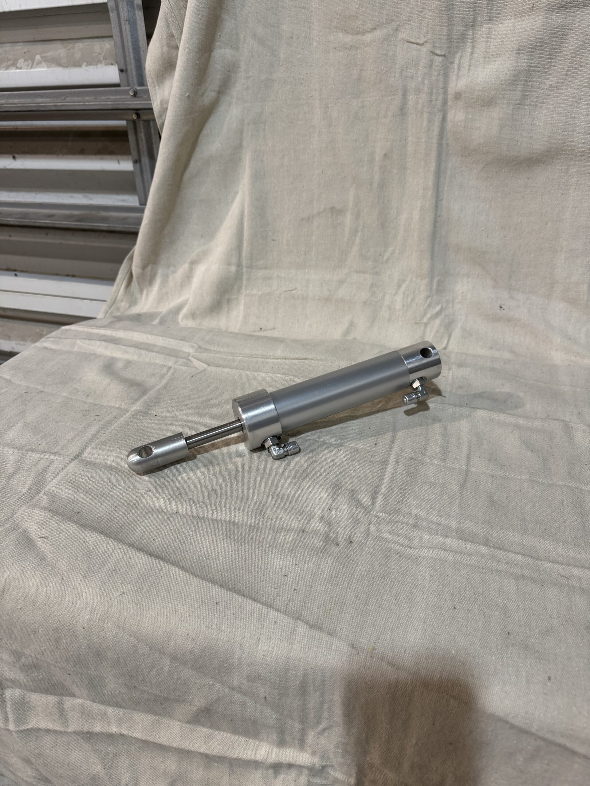 Stainless steel cylinder actuator with mounting brackets